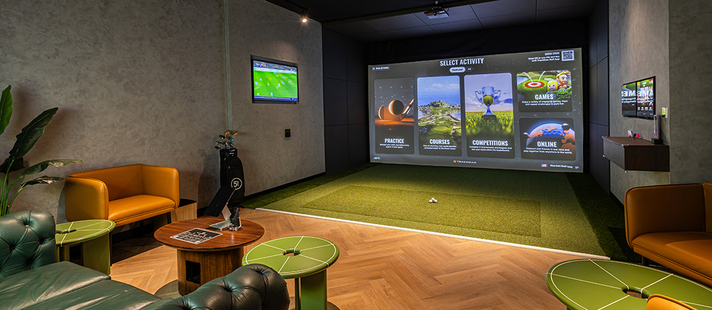 Friends at a premium indoor golf simulator lounge